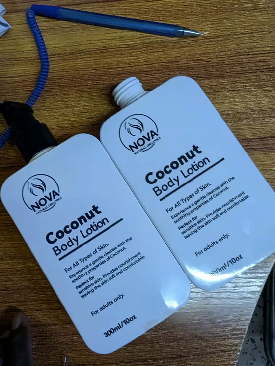 Two white Nova coconut body lotion bottles with printed labels.