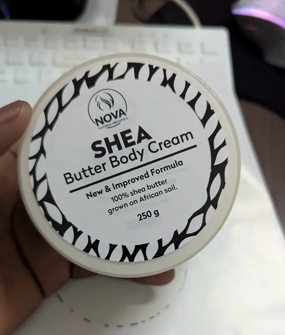 Nova shea butter body cream jar lid with a black and white patterned label.